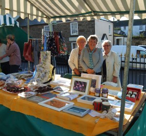 Muriel, Gill and Val behind our stall at the market