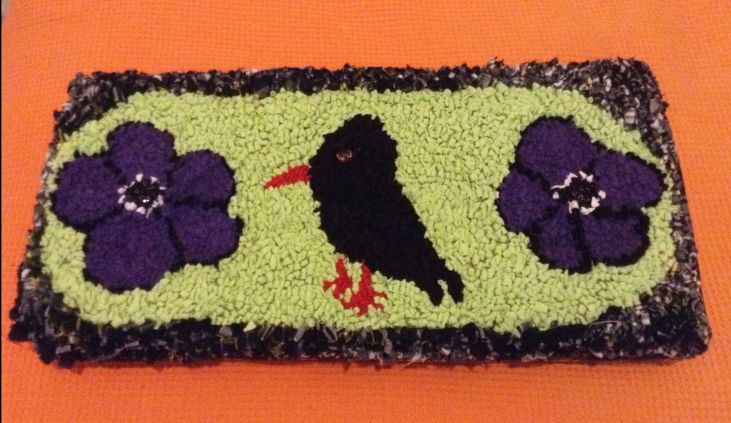 Clever Sue designed this beautiful cushion featuring anemones and a chough.