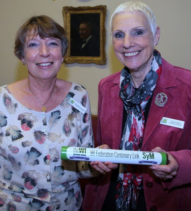 Elizabeth Lansman, Chairman of Suffolk West Federation, passes on the baton to Jane Collier, Chairman of Suffolk East.