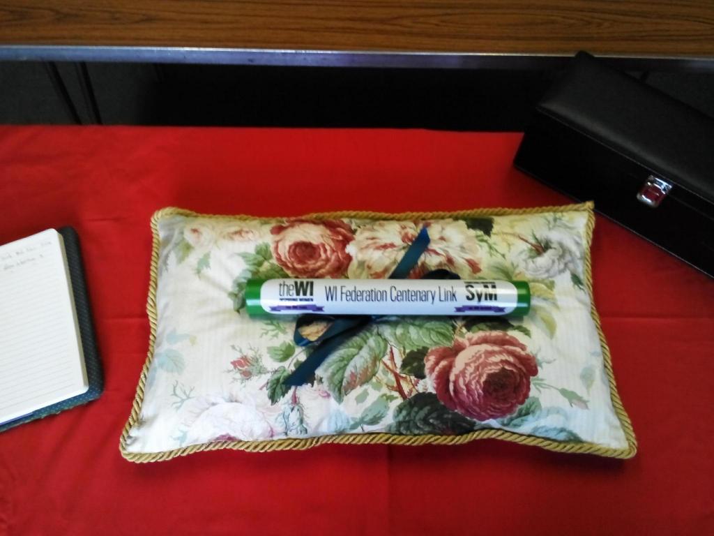 The Norfolk cushion proudly displays the baton