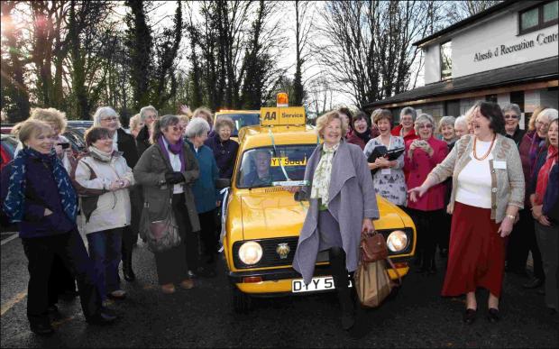 Alresford WI chairman Gill Graham holds the baton