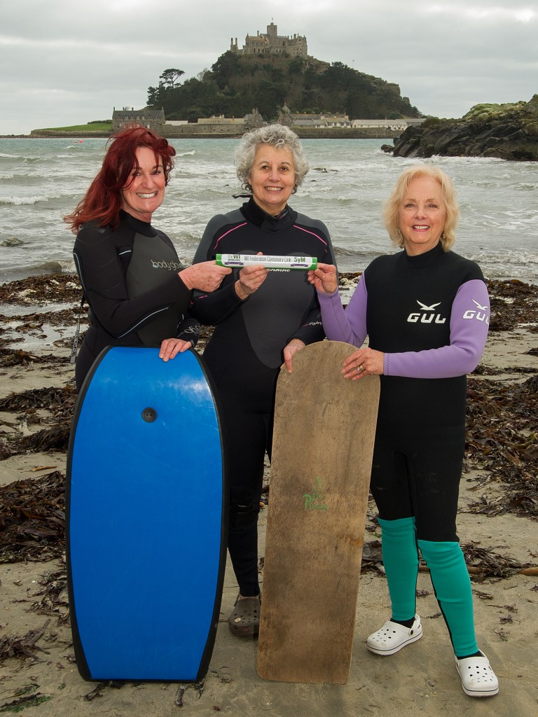 WI members Niamh Noone, Jane Twose and Pat Gloyn pose with surfboards in Marazion (057) Photo by Peter Puddiphatt