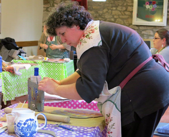 Sue working on her vase